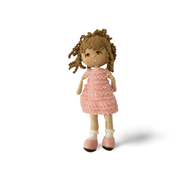 Lila Grace with blonde hair and brown eyes, dressed in pienk.A handcrafted doll, the only one of her kind. Exclusive to Die Trollie and never to be repeated again.