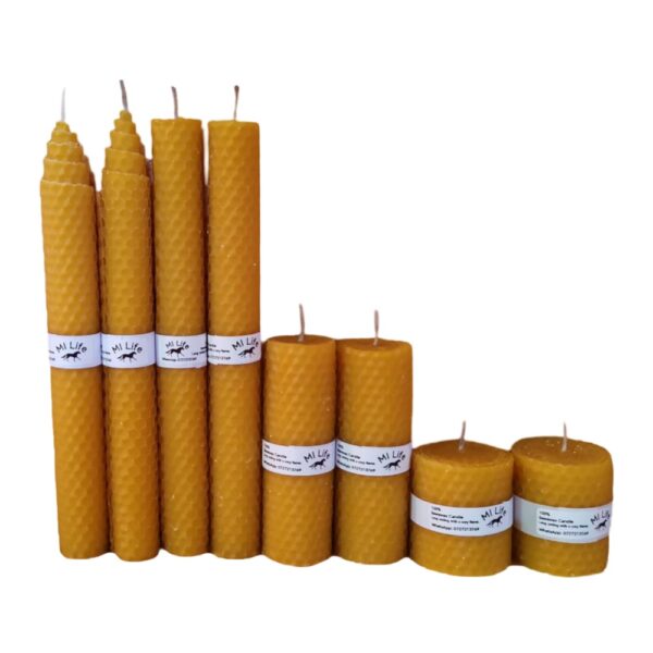 A collection of handcrafted 100% beeswax candles of different sizes, displayed in a stepped arrangement.