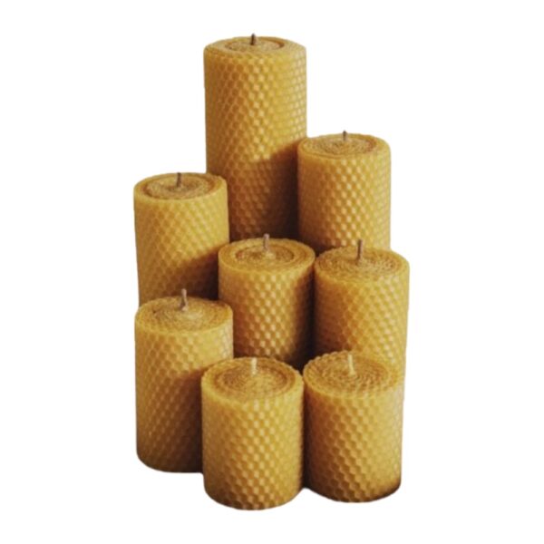 Seven yellow beeswax honeycomb pillar candles grouped together.
